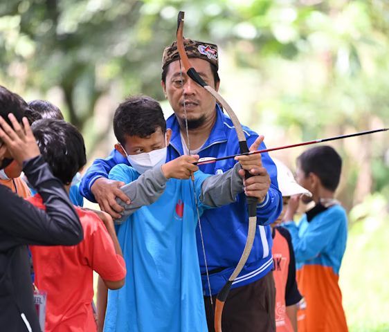 Traditional archery participants during a community session